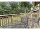 Private deck overlooking wooded area with seating for two at 110 Hartland Dr. # 15-E, Myrtle Beach, SC 29572
