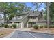 Attractive two-story condo with a gray exterior, landscaping, and parking at 110 Hartland Dr. # 15-E, Myrtle Beach, SC 29572