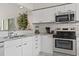 White cabinets, granite countertops, and stainless steel appliances at 110 Hartland Dr. # 15-E, Myrtle Beach, SC 29572