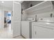 Laundry room with washer, dryer, and extra shelving at 110 Hartland Dr. # 15-E, Myrtle Beach, SC 29572