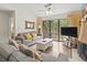 Living room with gray couches, coffee table, and access to a deck at 110 Hartland Dr. # 15-E, Myrtle Beach, SC 29572