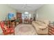 Relaxing living room features a fireplace, comfortable seating, and large window at 4516 N Plantation Harbour Dr. # H-12, Little River, SC 29566