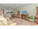 Open living room with comfortable seating, a fireplace, and a view of the kitchen at 4516 N Plantation Harbour Dr. # H-12, Little River, SC 29566