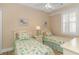 Bedroom with twin beds, featuring coastal-themed bedding at 4516 N Plantation Harbour Dr. # H-12, Little River, SC 29566