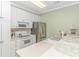 Modern kitchen with white cabinets, stainless steel appliances, and ample counter space at 4516 N Plantation Harbour Dr. # H-12, Little River, SC 29566