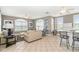 Bright community room with comfortable seating and kitchenette at 4516 N Plantation Harbour Dr. # H-12, Little River, SC 29566