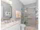 Modern bathroom with a walk-in shower and marble vanity at 4516 N Plantation Harbour Dr. # H-12, Little River, SC 29566