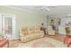 Spacious living room with comfortable seating and access to a patio at 4516 N Plantation Harbour Dr. # H-12, Little River, SC 29566