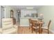 Cozy dining area with wood table and chairs, adjacent to the kitchen at 4516 N Plantation Harbour Dr. # H-12, Little River, SC 29566