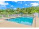 Inviting community pool with surrounding patio and seating at 4516 N Plantation Harbour Dr. # H-12, Little River, SC 29566