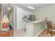 Bright kitchen boasts white cabinets, stainless steel appliances, and tile flooring at 4516 N Plantation Harbour Dr. # H-12, Little River, SC 29566