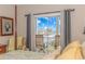 Main bedroom with water views and private balcony access at 4516 N Plantation Harbour Dr. # H-12, Little River, SC 29566