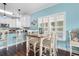 Charming dining area with white table and chairs at 117B Ocean Blvd. S, Surfside Beach, SC 29575