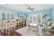 Open living space with a dining area, access to patio, and coastal decor at 117B Ocean Blvd. S, Surfside Beach, SC 29575