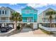 Two-story teal house with balcony and garage at 117B Ocean Blvd. S, Surfside Beach, SC 29575