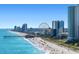 Oceanfront view of beach with pier and skyline at 1120 Hickory Knob Ct., Myrtle Beach, SC 29579