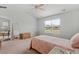 Spacious bedroom with carpeted floor, a twin bed, and a window offering backyard views at 1120 Hickory Knob Ct., Myrtle Beach, SC 29579
