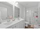 Clean bathroom with double vanity, a shower, and neutral-toned finishes at 1120 Hickory Knob Ct., Myrtle Beach, SC 29579