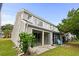 Tan two-story townhome with balcony, sliding glass doors, and a small yard at 500 Deer Creek Rd. # D, Surfside Beach, SC 29575