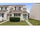 Two-story townhouse with teal door and landscaping at 500 Deer Creek Rd. # D, Surfside Beach, SC 29575