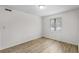 Bright bedroom with light walls, wood-look floors, and a window with blinds at 500 Deer Creek Rd. # D, Surfside Beach, SC 29575