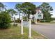 Community entrance with signage for Villas on the Green at 500 Deer Creek Rd. # D, Surfside Beach, SC 29575