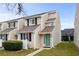 Two-story townhouse with teal door and landscaping at 500 Deer Creek Rd. # D, Surfside Beach, SC 29575
