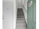 Gray carpeted staircase between two doors at 500 Deer Creek Rd. # D, Surfside Beach, SC 29575