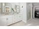 Modern bathroom with a double vanity, glass shower, and gold fixtures at 512 9Th Ave. S, North Myrtle Beach, SC 29582