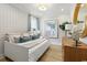 Relaxing bedroom with a daybed, wooden dresser, and stylish wall art at 512 9Th Ave. S, North Myrtle Beach, SC 29582