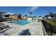 Inviting community pool with lounge chairs, paver patio, and nearby homes at 512 9Th Ave. S, North Myrtle Beach, SC 29582