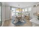 Stylish dining area with a unique circular light fixture and contemporary seating at 512 9Th Ave. S, North Myrtle Beach, SC 29582