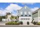 Charming two-story home with a blue and white exterior, a garage, and landscaped front yard at 512 9Th Ave. S, North Myrtle Beach, SC 29582