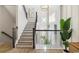 Welcoming foyer with a grand staircase, stylish chandelier, and decorative accents at 512 9Th Ave. S, North Myrtle Beach, SC 29582