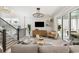 Inviting living area with plush furnishings, a staircase, and access to a private balcony at 512 9Th Ave. S, North Myrtle Beach, SC 29582