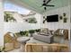 Backyard patio with a fire pit, modern furniture, and lush greenery at 512 9Th Ave. S, North Myrtle Beach, SC 29582