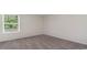Spacious bedroom with window and neutral decor at 831 Buttonwood Dr., Conway, SC 29527