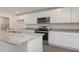 Modern kitchen with white cabinets, granite countertops, and island at 831 Buttonwood Dr., Conway, SC 29527
