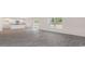 Open concept kitchen and living area with gray vinyl plank flooring throughout at 831 Buttonwood Dr., Conway, SC 29527