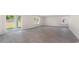Spacious living room with gray vinyl plank flooring and sliding glass door to backyard at 831 Buttonwood Dr., Conway, SC 29527