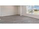 Spacious living room with gray vinyl plank flooring and large windows at 831 Buttonwood Dr., Conway, SC 29527