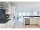 Modern kitchen with white cabinets, stainless steel appliances, and herringbone backsplash at Tbb1 Shady Grove Rd., Conway, SC 29527