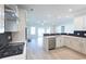 Modern kitchen with white cabinets, stainless steel appliances, and herringbone backsplash at Tbb1 Shady Grove Rd., Conway, SC 29527