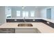Modern kitchen sink and countertop with a herringbone tile backsplash at Tbb1 Shady Grove Rd., Conway, SC 29527
