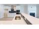 Modern kitchen sink and countertop with a herringbone tile backsplash at Tbb1 Shady Grove Rd., Conway, SC 29527