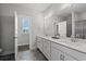 Modern bathroom with double vanity and white cabinets at 200 Delano Way, Myrtle Beach, SC 29588