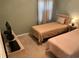 Second bedroom with two twin beds and a TV at 616 River Oaks Dr. # 54F, Myrtle Beach, SC 29579