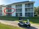 Exterior view of the building with a highlighted balcony, next to a golf course at 616 River Oaks Dr. # 54F, Myrtle Beach, SC 29579