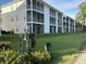 Exterior view of the building from the golf course, featuring the 9th hole at 616 River Oaks Dr. # 54F, Myrtle Beach, SC 29579