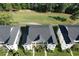 Three-story condominiums overlooking a lush green golf course at 616 River Oaks Dr. # 54F, Myrtle Beach, SC 29579